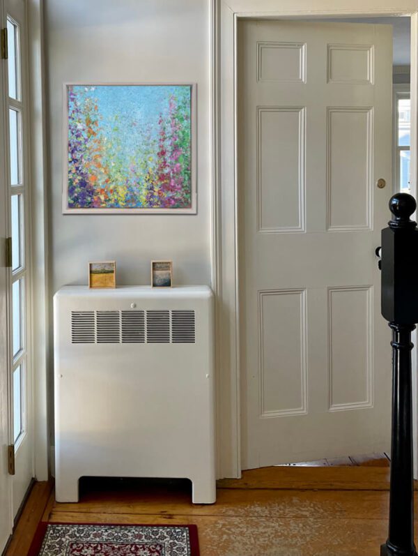 An August. Gladiolus, 20 x 20 x 2 inches, custom-made white-washed floater frame radiator in front of a door with a painting on it.